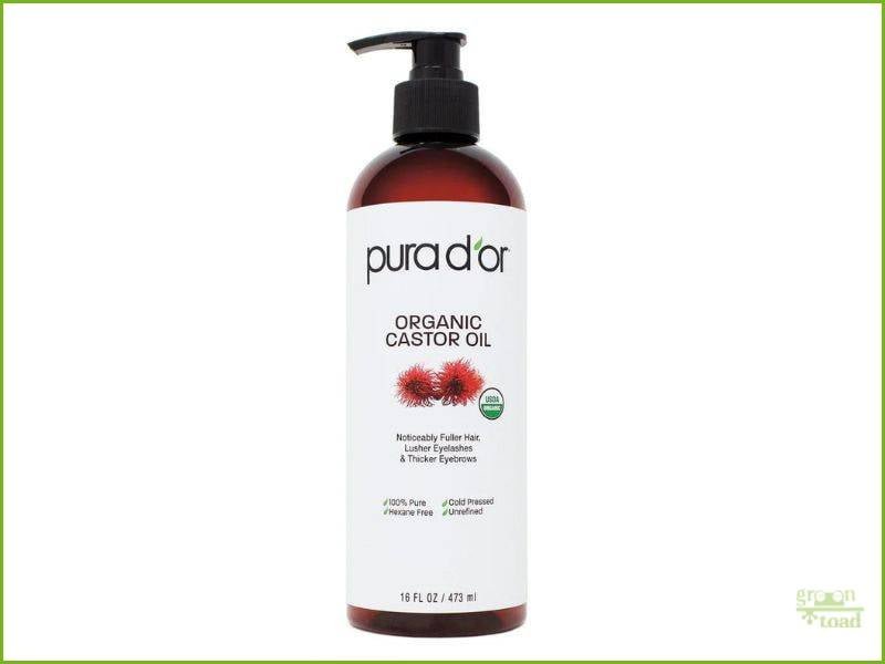 Image of Pura D'or Organic Castor Oil bottle with pump, 16 fl oz, labeled for hair, eyelashes, and eyebrows growth, 100% pure, cold-pressed.